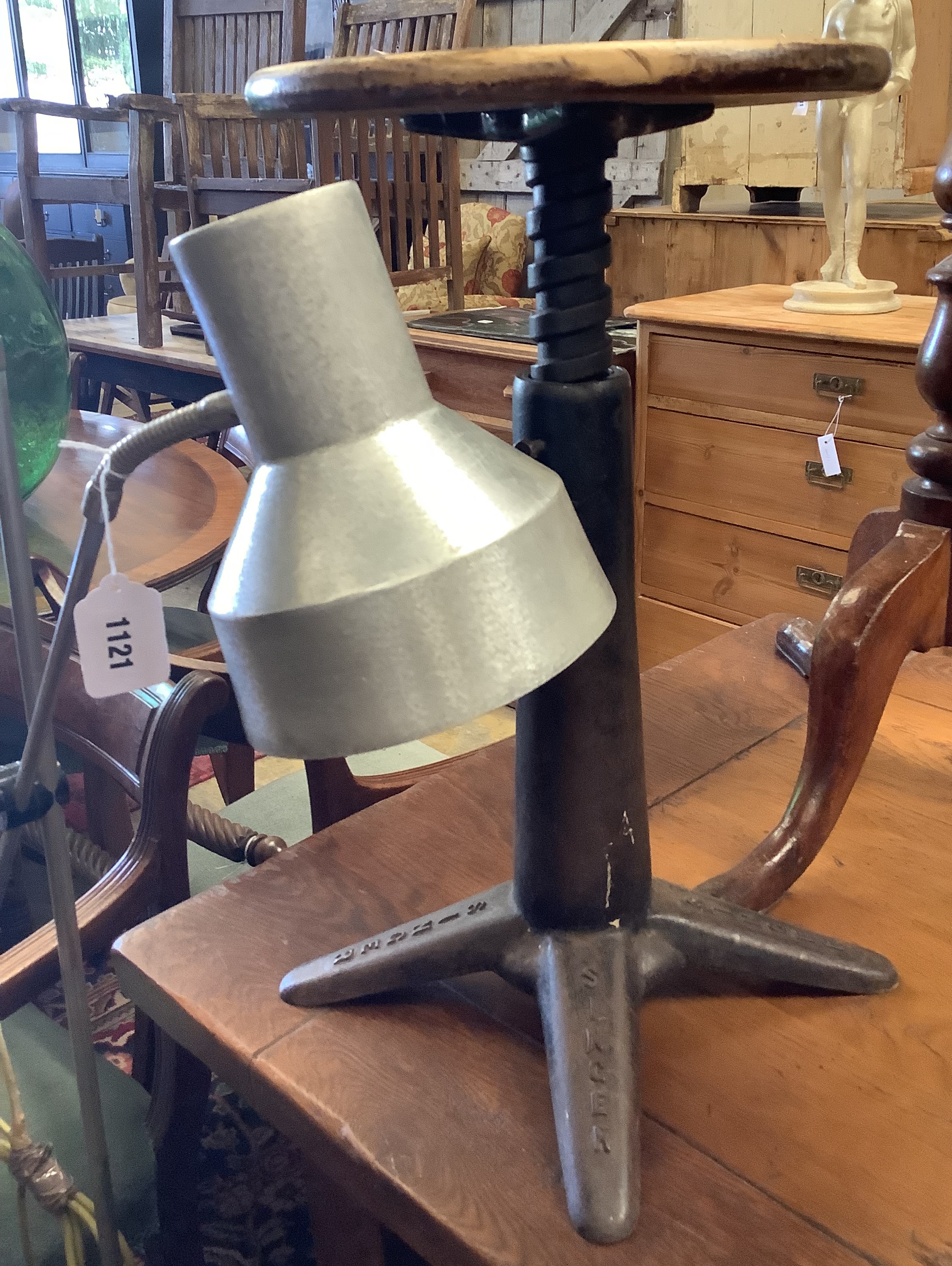 A vintage cast iron Singer stool and an industrial style floor lamp (2)
